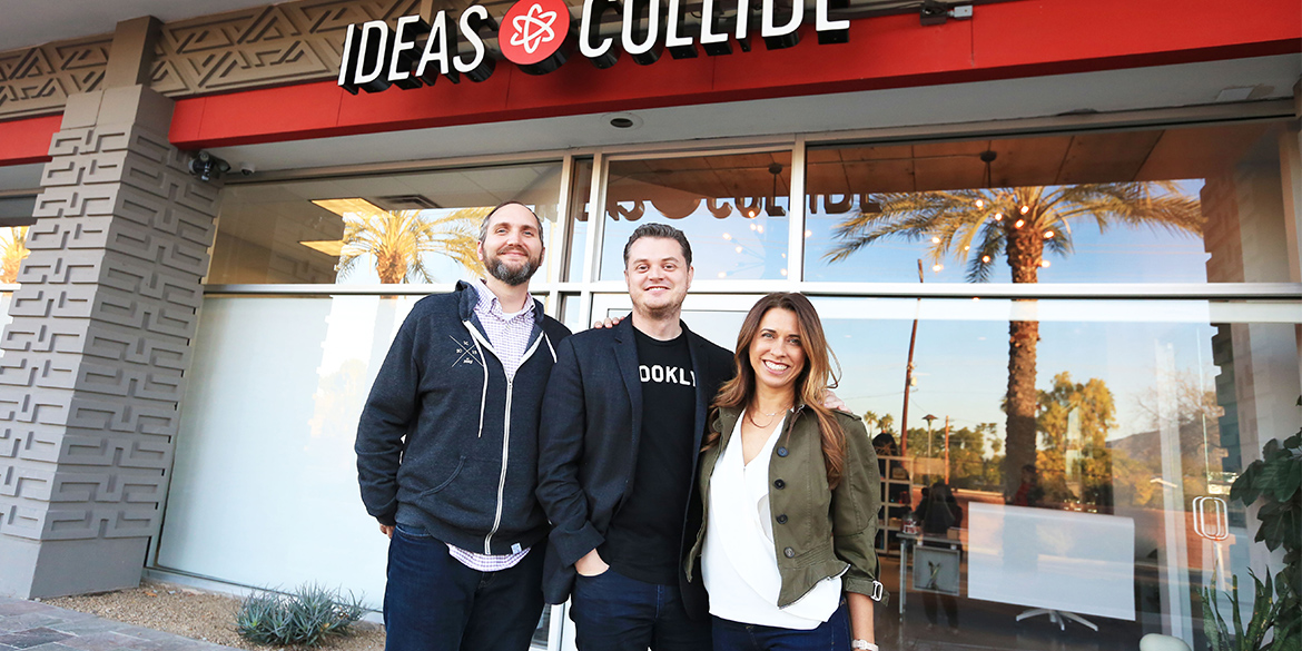 Ideas Collide founders in front of building